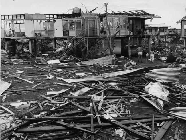 Cyclone Tracy caused major destruction to Darwin. John and Meg O’Brien’s home after Cyclone Tracy. John O’Brien and Julia Archer are sitting on the verandah facing front. ‘Are you all right, do you need a hand’ people said to each other amidst the ruins of Darwin after Cyclone Tracy. By midday on Christmas Day 1974, Darwin people had the emergency situation under control - they had plotted the path for their city’s renewal.