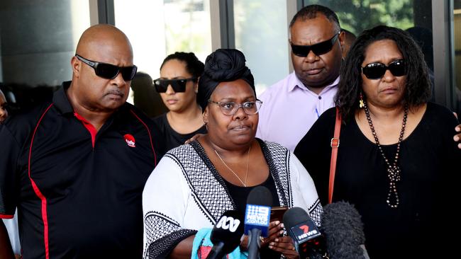 Former daycare centre director Michael Glenn Lewis, 46, has been sentenced for manslaughter over the death of Maliq Nicholas Floyd Namok-Malamoo, 3, who was left on a daycare bus. Meeky's family including mum Muriel Namok, centre, speak to media ouside the Cairns Court. Picture: Stewart McLean