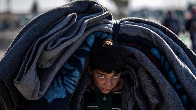 A Syrian Kurdish child, fleeing with their family from their home in the outskirts of the northern city of Aleppo. Picture: Delil Souleiman / AFP