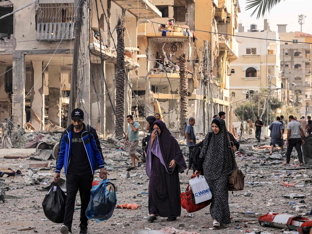 Palestinians leave al-Karama neighbourhood in Gaza City to safer areas as raging battles between Israel and Hamas. Picture: AFP