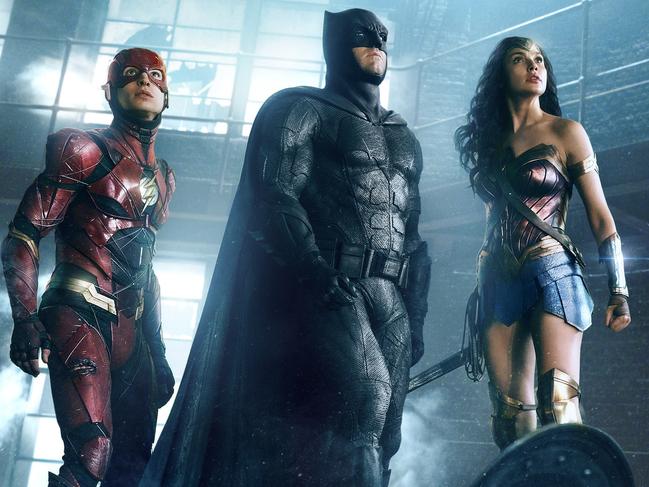 EZRA MILLER as The Flash, BEN AFFLECK as Batman and GAL GADOT as Wonder Woman in a scene from Warner Bros. Pictures' action adventure film JUSTICE LEAGUE