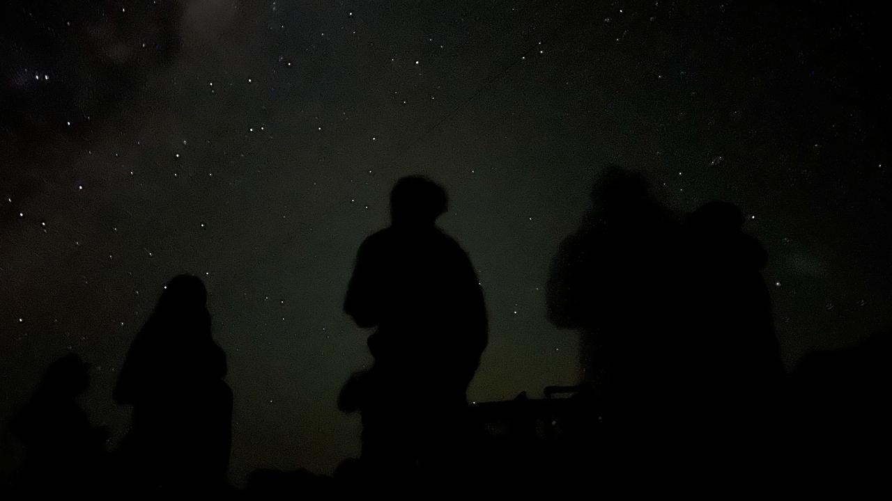 Twelve eager tourists take in one of, if not the, darkest sky they will ever see. Picture: Chantelle Francis