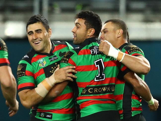 Alex Johnston celebrates with his Rabbitohs after scoring against the Bulldogs. Picture: Getty Images