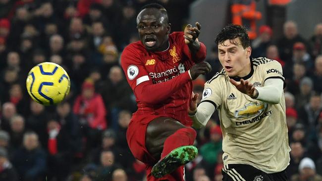 Sadio Mane challenges Manchester United's Swedish defender Victor Lindelof as Liverpool powered to another victory. Picture: Paul Ellis/AFP