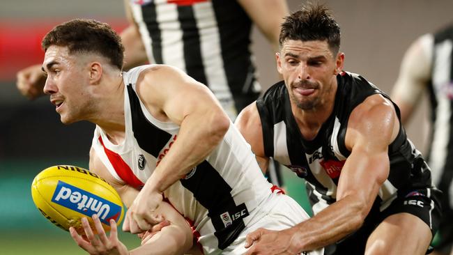 Jade Gresham gets a handball away under pressure from Collingwood captain Scott Pendlebury in June this year. Picture: Getty Images