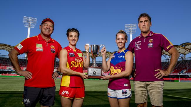 The Suns and Lions are going head to head on Saturday in the first AFLW Q-Clash. Suns coach David Lake, Suns Sam Virgo, Lions Lauren Arnell and Lions Craig Starcevich at Metricon Stadium, Picture: Jerad Williams