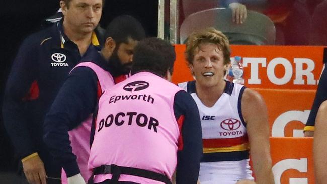 Rory Sloane talks with Adelaide doctors on Saturday night.