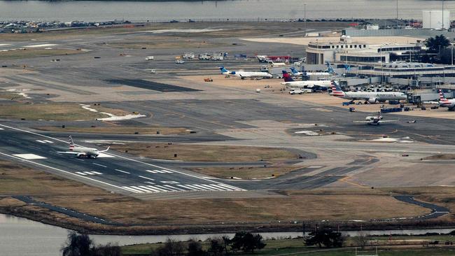 An American Airlines plane takes off from Ronald Reagan National Airport in Arlington, Virginia, on January 18, 2022, as seen from Washington, DC. Picture: AFP