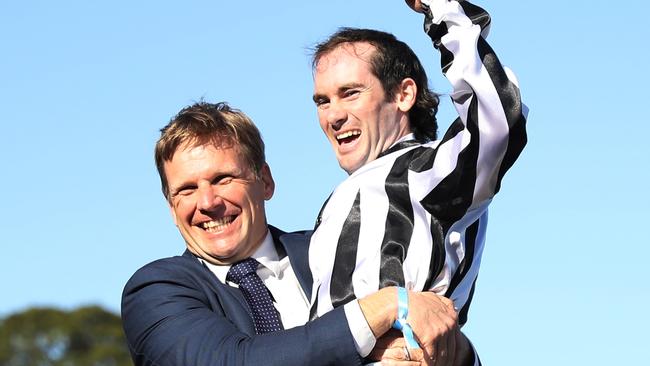 SYDNEY, AUSTRALIA - OCTOBER 26: Trainer Bjorn Baker celebrates after Tyler Schiller riding Belclare wins Race 8 The Invitation during "Spring Champion Stakes Day" Sydney Racing at Royal Randwick Racecourse on October 26, 2024 in Sydney, Australia. (Photo by Jeremy Ng/Getty Images)