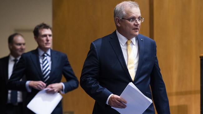 Prime Minister Scott Morrison with Attorney-General Christian Porter and head of the national COVID-19 co-ordination Commission Nev Power. Picture: Getty Images