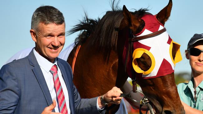 Trainer Matthew Smith poses with Fierce Impact after winning in race 9, the Lamaro's Hotel Sth Melbourne Toorak Handicap, during the Caulfield Guineas Day at Caulfield Racecourse in Melbourne, Saturday, October 12, 2019. (AAP Image/Vince Caligiuri) NO ARCHIVING, EDITORIAL USE ONLY