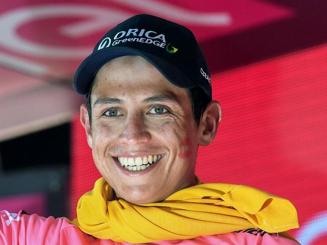 Colombian rider Esteban Chaves celebrates on the podium the pink jersey of the overall leader after completing the 19th stage of the Giro d'Italia Tour of Italy cycling race from Pinerolo to Risoul, France, Friday, May 27 2016. Chaves surprisingly took the overall lead in the Giro d'Italia following a wild 19th stage Friday. (Alessandro di Meo/ANSA via AP)