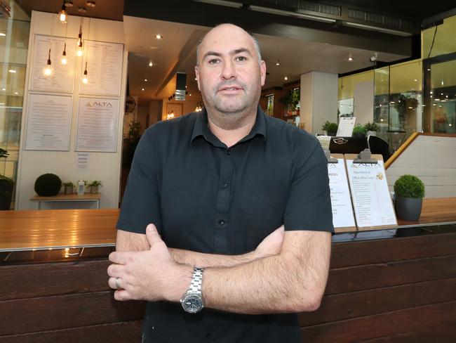 Darren McGillivray at his cafe. Pic Annette Dew