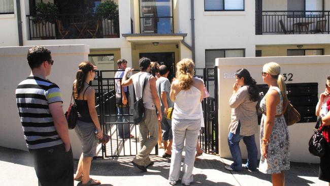 Group of prospective tenants queue outside a complex to inspect a one bedroom apartment in Clovelly, Sydney.