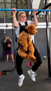 This gym enthusiast has used her dog in her workouts