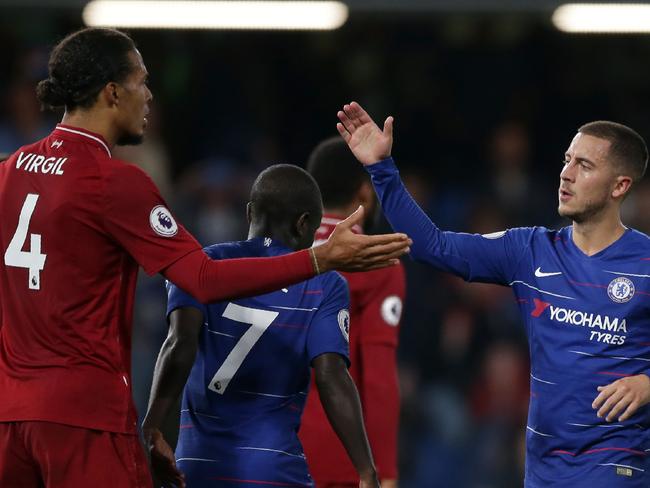 Liverpool's Dutch defender Virgil van Dijk (L) and Chelsea's Belgian midfielder Eden Hazard shake hands after the English Premier League football match between Chelsea and Liverpool. Picture: AFP