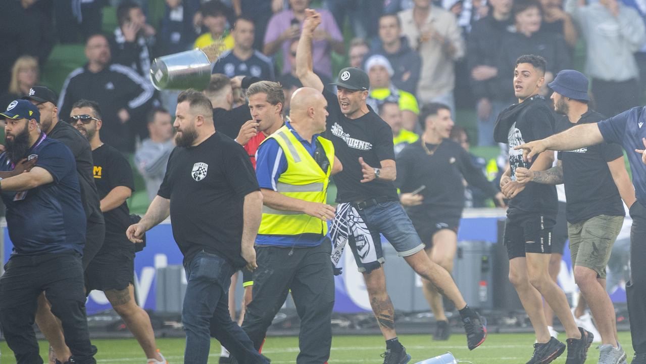 Melbourne Victory fans invade the pitch at AAMI Park