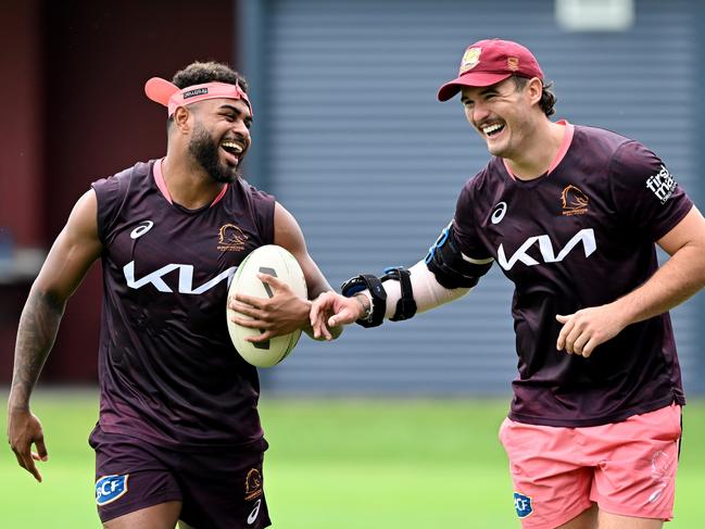 BRISBANE, AUSTRALIA - JANUARY 05: Ezra Mam and Kobe Hetherington share a laugh during a Brisbane Broncos NRL training session at Gilbert Park on January 05, 2023 in Brisbane, Australia. (Photo by Bradley Kanaris/Getty Images)