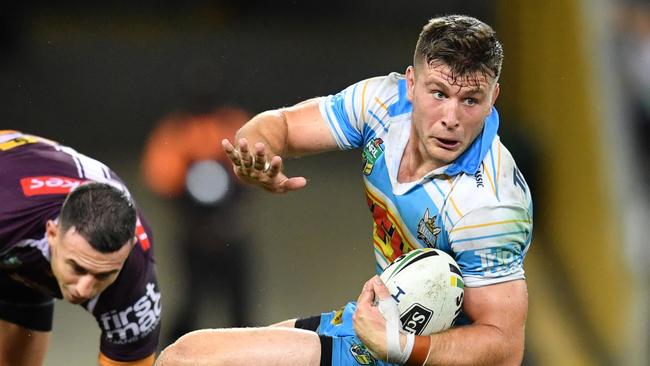 Jai Arrow (right) of the Titans gets past Darius Boyd (left) of the Broncos during the Round 4 NRL match between the Brisbane Broncos and the Gold Coast Titans at Suncorp Stadium in Brisbane, Sunday, April 1, 2018. (AAP Image/Darren England) NO ARCHIVING, EDITORIAL USE ONLY