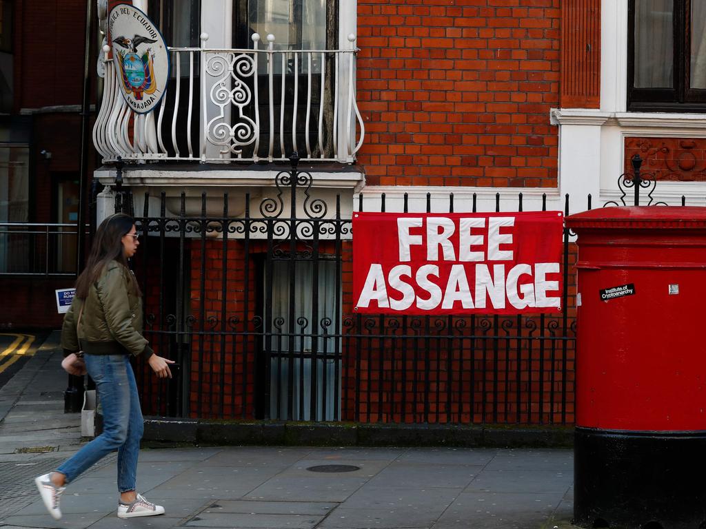 A woman walks past the Ecuadorean Embassywhere Julian Assange has been living under asylum since 2012. Picture: AFP