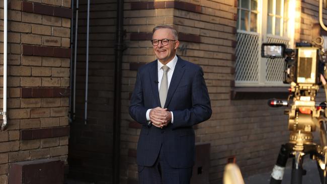 Anthony Albanese outside his childhood Camperdown council flat ahead of the final sprint of the election campaign.