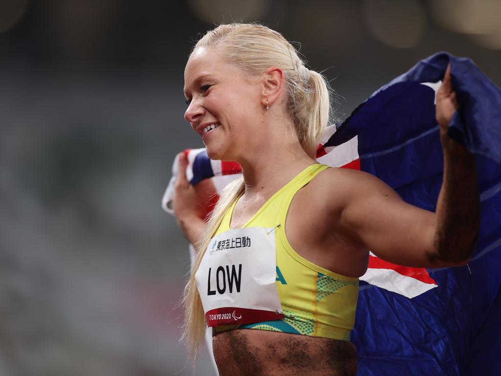 Vanessa Low celebrates with the Aussie flag. Photo by Alex Pantling/Getty Images.