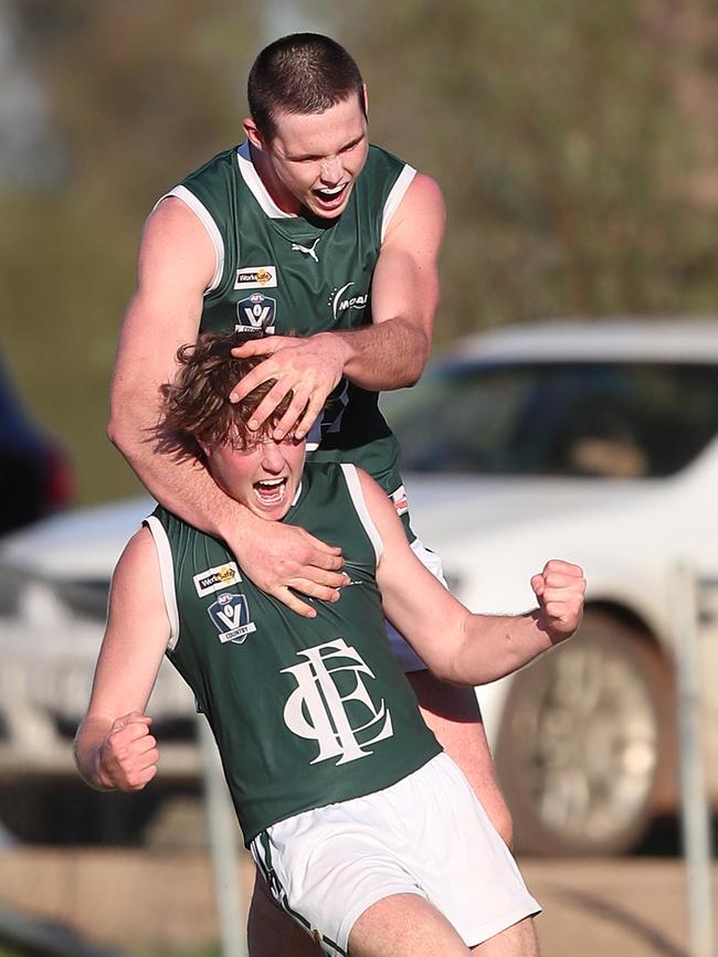 Echuca teammates Jackson Stewart and Hugh Byrne celebrate a goal.