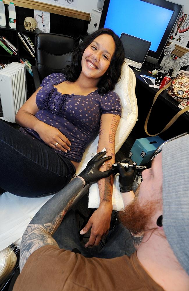 Jess being tattooed.