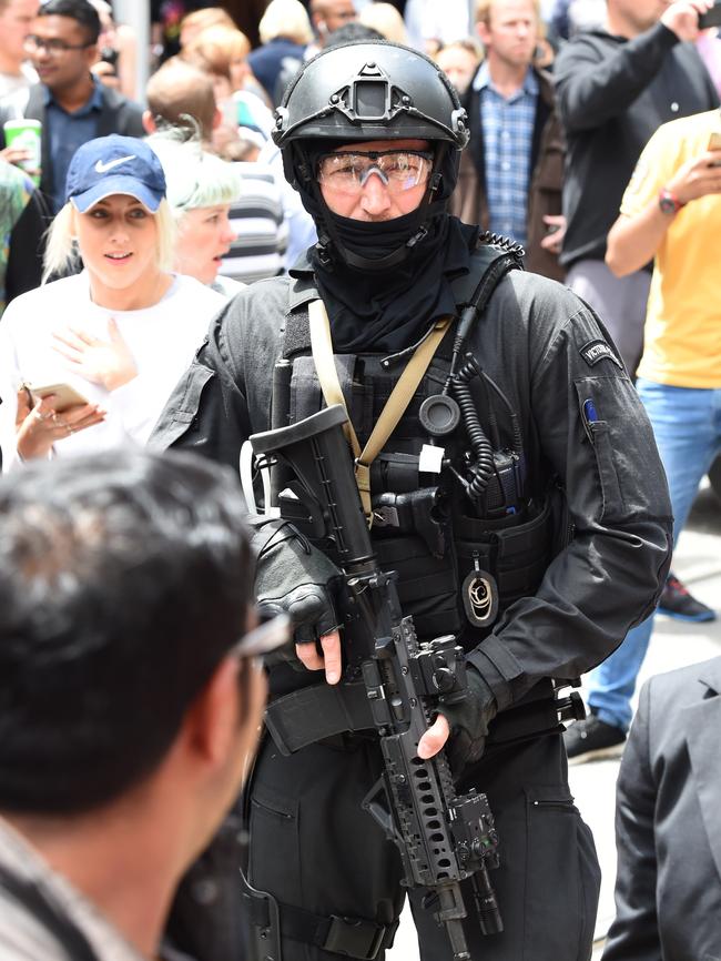 Police SOG members on the crowded Bourke St Mall. Picture: Lawrence Pinder