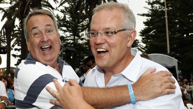 Scott Morrison celebrates Australia Day in Cronulla with Glenn Wheeler. The Liberal government has plenty of good news to share, but its being lost in a sea of jingoism. Picture: Chris Pavlich