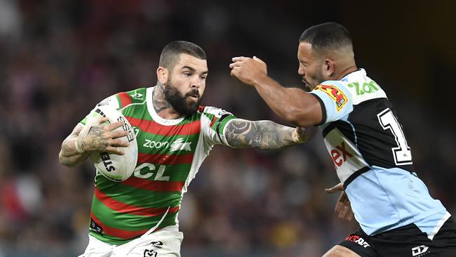 BRISBANE, AUSTRALIA – MAY 15: Adam Reynolds of the Rabbitohs is tackled during the round 10 NRL match between the Cronulla Sharks and the South Sydney Rabbitohs at Suncorp Stadium, on May 15, 2021, in Brisbane, Australia. (Photo by Albert Perez/Getty Images)