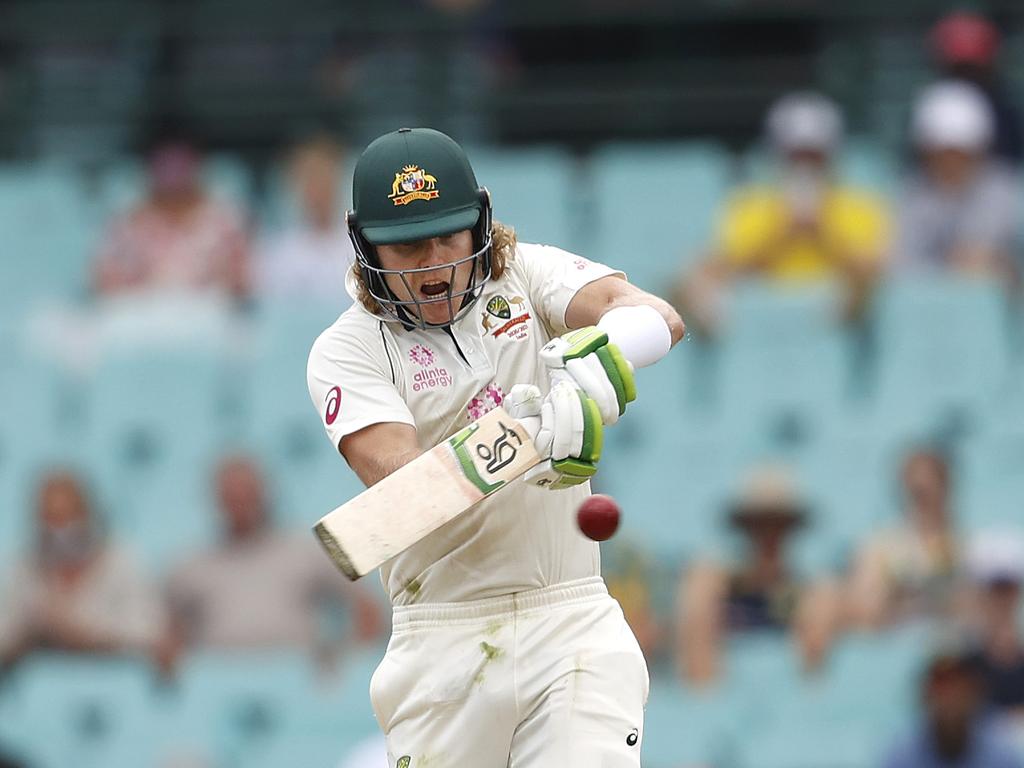 Australia's Will Pucovski pulls to bring up his fifty.