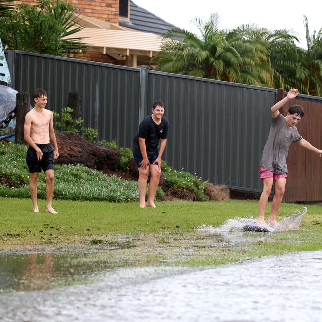 Local kids Joshua (black shirt), Billy (pink shorts) and Alex (no shirt) enjoying themselves in the water. Picture: David Clark
