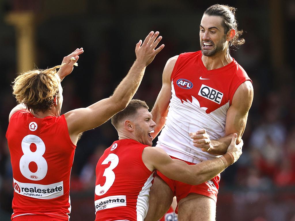 Adams was the first to get around his good mate Brodie Grundy after the ruckman’s first goal for the Swans. Picture: Phil Hillyard