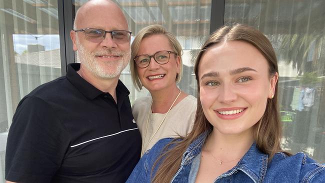 Bryony Baker with her parents, Sue and Paul, says one teacher helped her turn study around after an ADHD diagnosis. Picture: supplied