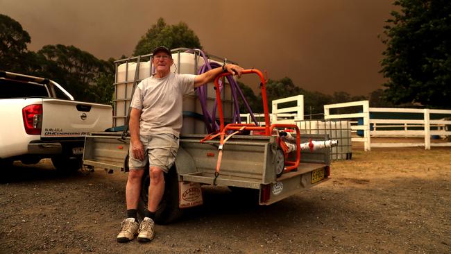 Graham Daley prepares to defend his property. Picture: Richard Dobson