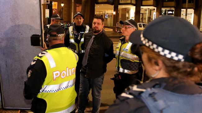 Police arrest Far-right activist Neil Erikson outside the Sofitel.