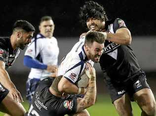 EARNING RESPECT: Yamba's Luke Douglas bursts through the New Zealand defence while representing Scotland during the Four Nations tournament in England. It was a historic clash for Scotland as they finished with an 18-all draw. Picture: Martin Rickett