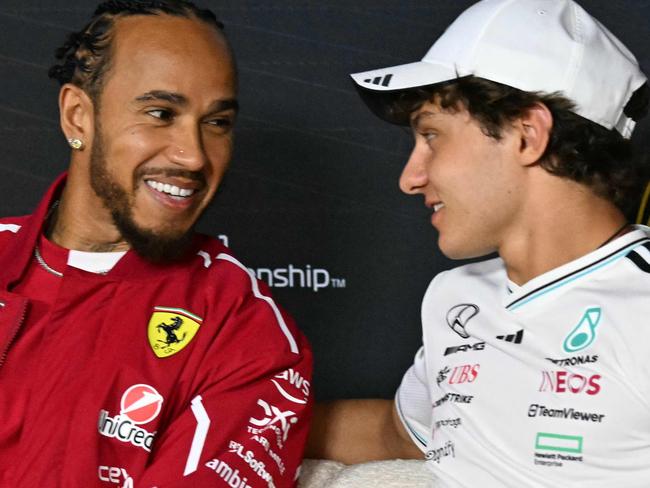 Mercedes' Italian driver Andrea Kimi Antonelli speaks alongside Ferrari's British driver Lewis Hamilton during a press conference at the Albert Park circuit in Melbourne on March 13, 2025, ahead of the Formula One Australian Grand Prix. (Photo by Saeed KHAN / AFP) / --IMAGE RESTRICTED TO EDITORIAL USE - STRICTLY NO COMMERCIAL USEâ