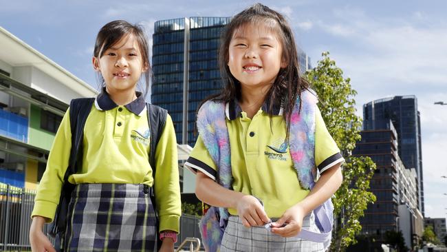 The playground at Wentworth Point Public School has started to be taken over by demountables. Students Madison Miranda (left) and her friend Jacqueline Tjie (right). Picture: Jonathan Ng