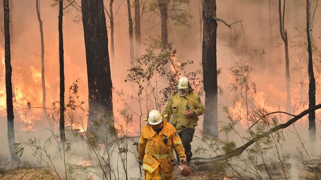 Firefighters battle a blaze in Nowra. Picture: AFP