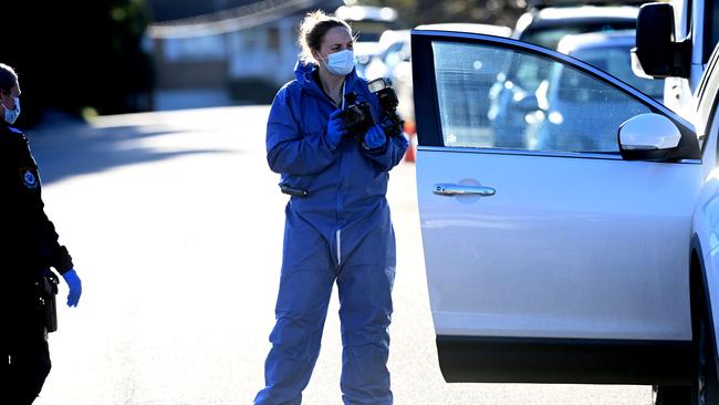 A forensics officer outside the Unwin Street property. Picture: Jeremy Piper