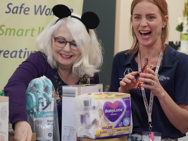 Mackay Women's Services executive director Linda-Ann Northey with child and adolescent counsellor Kelly and Ergon Energy Mackay program officer Kelly Arnold, looking at Ergon Energy's gifts for the two new child and adolescent counselling rooms, April 21, 2021. Picture: Heidi Petith