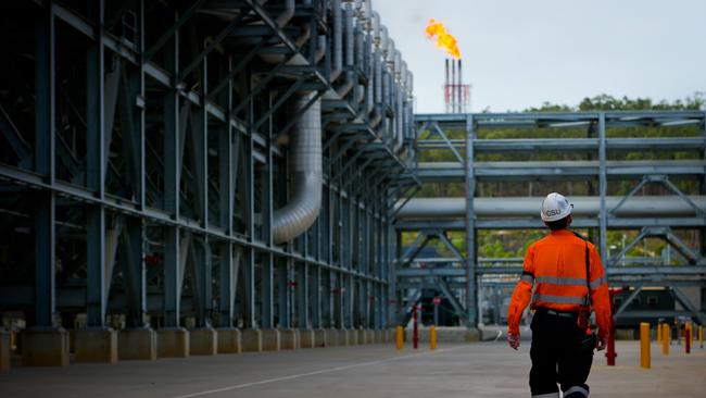 A worker walks through the Queensland Curtis Liquefied Natural Gas project site. Picture: Bloomberg