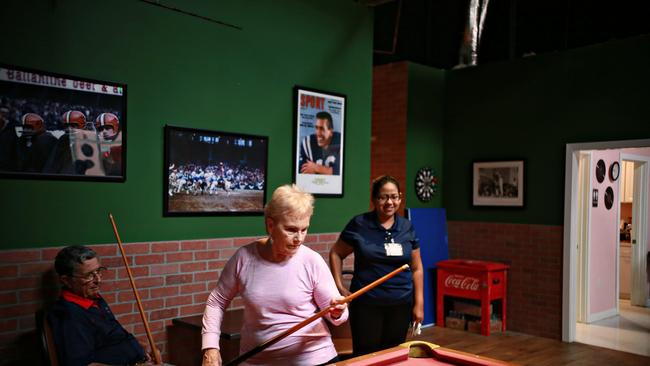 Guests play pool at Glenner Town Square in San Diego, meant to represent the era from roughly 1953 to 1961 when the 80-something Alzheimer’s patients were in the prime of their life. Picture: Sandy Huffaker/The Wall Street Journal