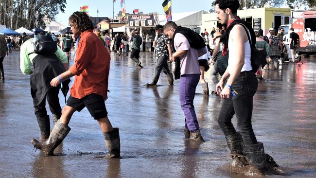 Splendour in the Grass attendees waded through thick mud. Picture: Tessa Flemming