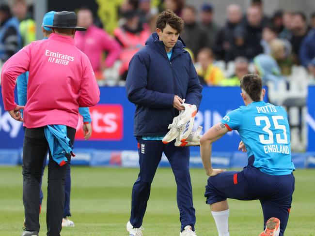 BRISTOL, ENGLAND - SEPTEMBER 29:  Matthew Potts of England changes one of his shoes during the 5th Metro Bank ODI between England and Australia at Seat Unique Stadium on September 29, 2024 in Bristol, England. (Photo by Dan Istitene/Getty Images)