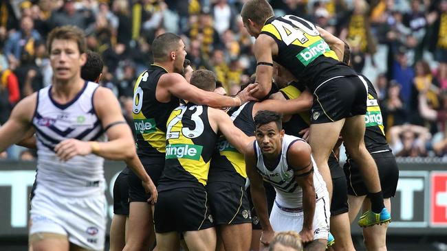 Richmond players celebrate after Brandon Ellis’ last-minute goal. Picture: Wayne Ludbey