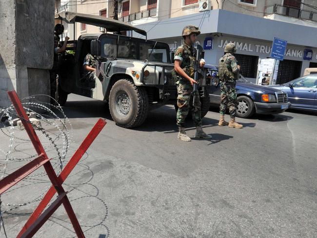 Lebanese army soldiers guard a street in the northern Lebanese port city of Tripoli. AFP PHOTO/IBRAHIM CHALHOUB