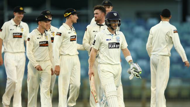 Peter Nevill walks off after falling just short of dragging NSW to victory.
